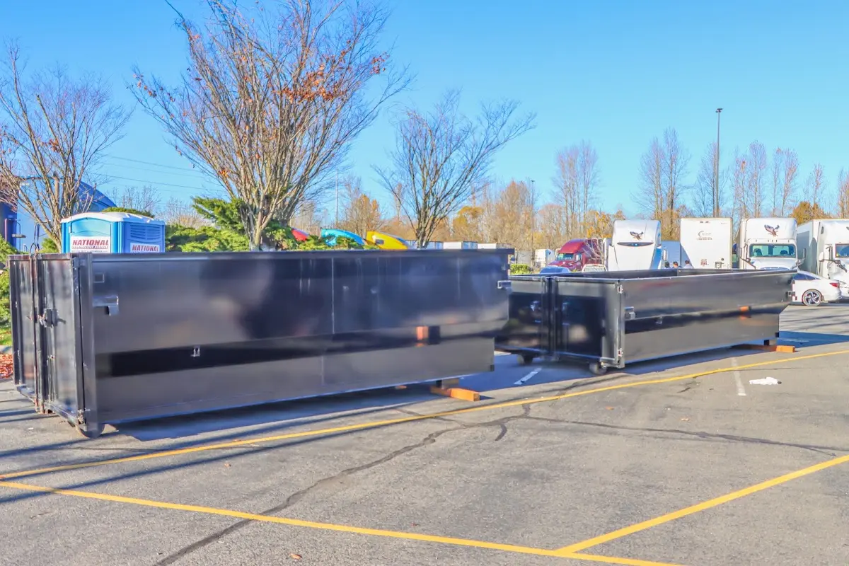 Professional dumpster rental service with roll-off container on residential driveway in Effingham